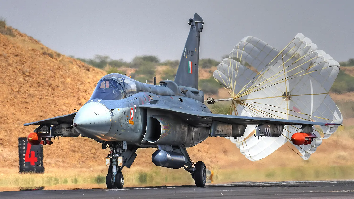 Fighter jet with landing parachute deployed