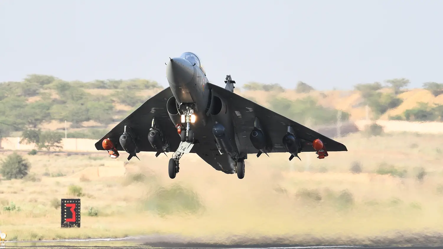 Advanced fighter jet in formation takeoff